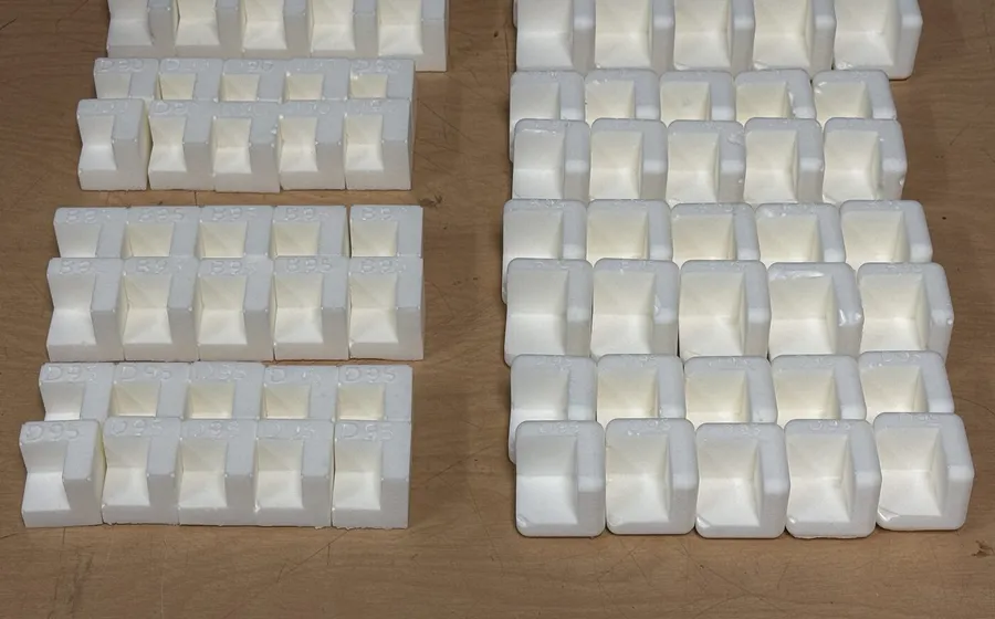 Rows of cast Super Foam case corners for battery boxes