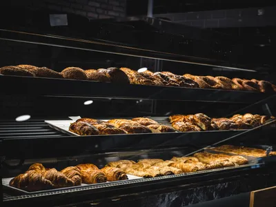 Butter croissants cooling on the counter at Cedar & Stone Bakery