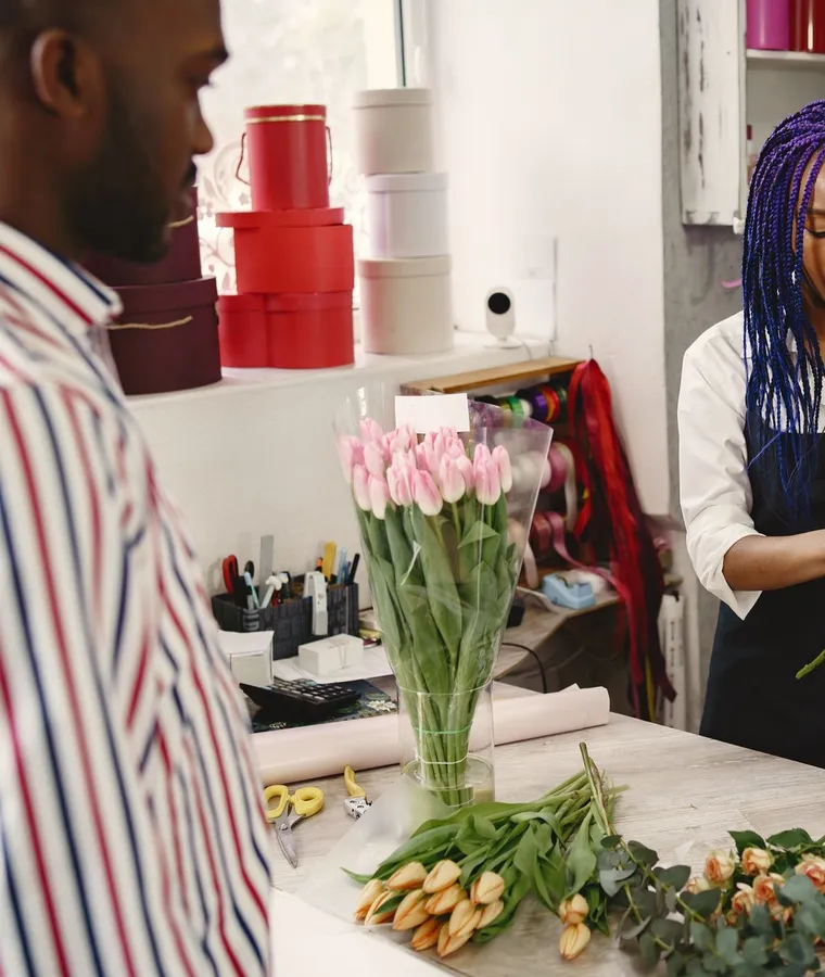 A florist working with flowers in a shop