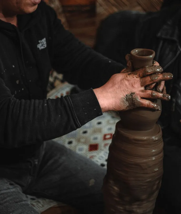 An artisan at work in a pottery studio