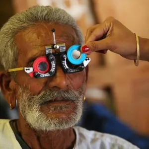 Senior&nbsp;man&nbsp;having&nbsp;vision&nbsp;test&nbsp;with&nbsp;trial&nbsp;lens&nbsp;set&nbsp;during&nbsp;eye&nbsp;exam.