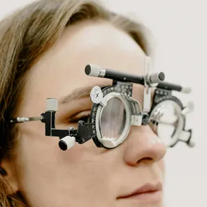 Close-up&nbsp;of&nbsp;a&nbsp;woman&nbsp;wearing&nbsp;trial&nbsp;glasses&nbsp;during&nbsp;an&nbsp;eye&nbsp;examination&nbsp;at&nbsp;a&nbsp;clinic.