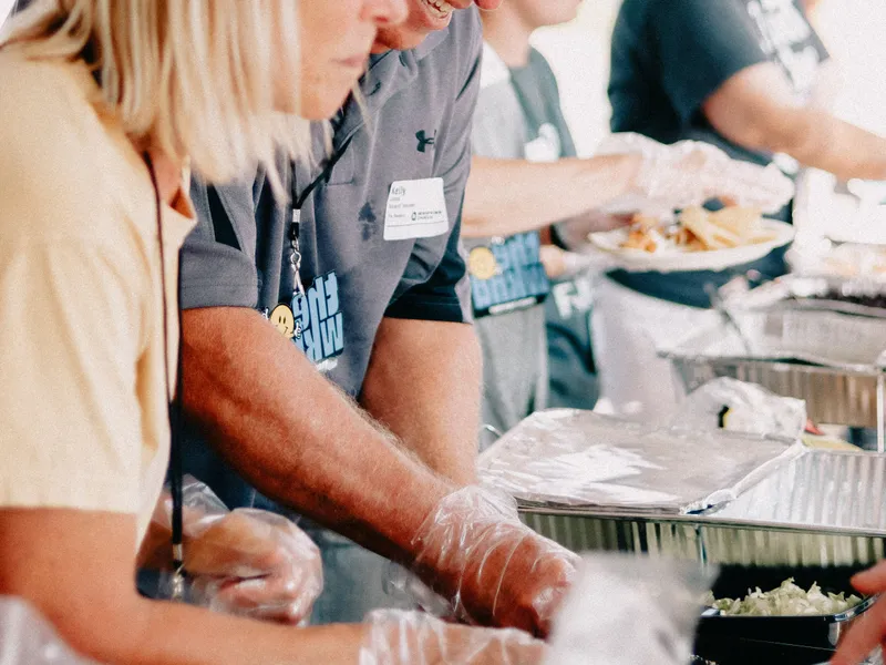 Volunteers&nbsp;serving&nbsp;free&nbsp;community&nbsp;meals&nbsp;at&nbsp;SciEats