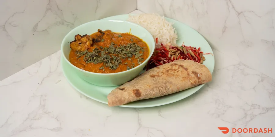 SciEats Chicken Tikka Masala served with basmati rice, whole-wheat roti, and rainbow salad.
