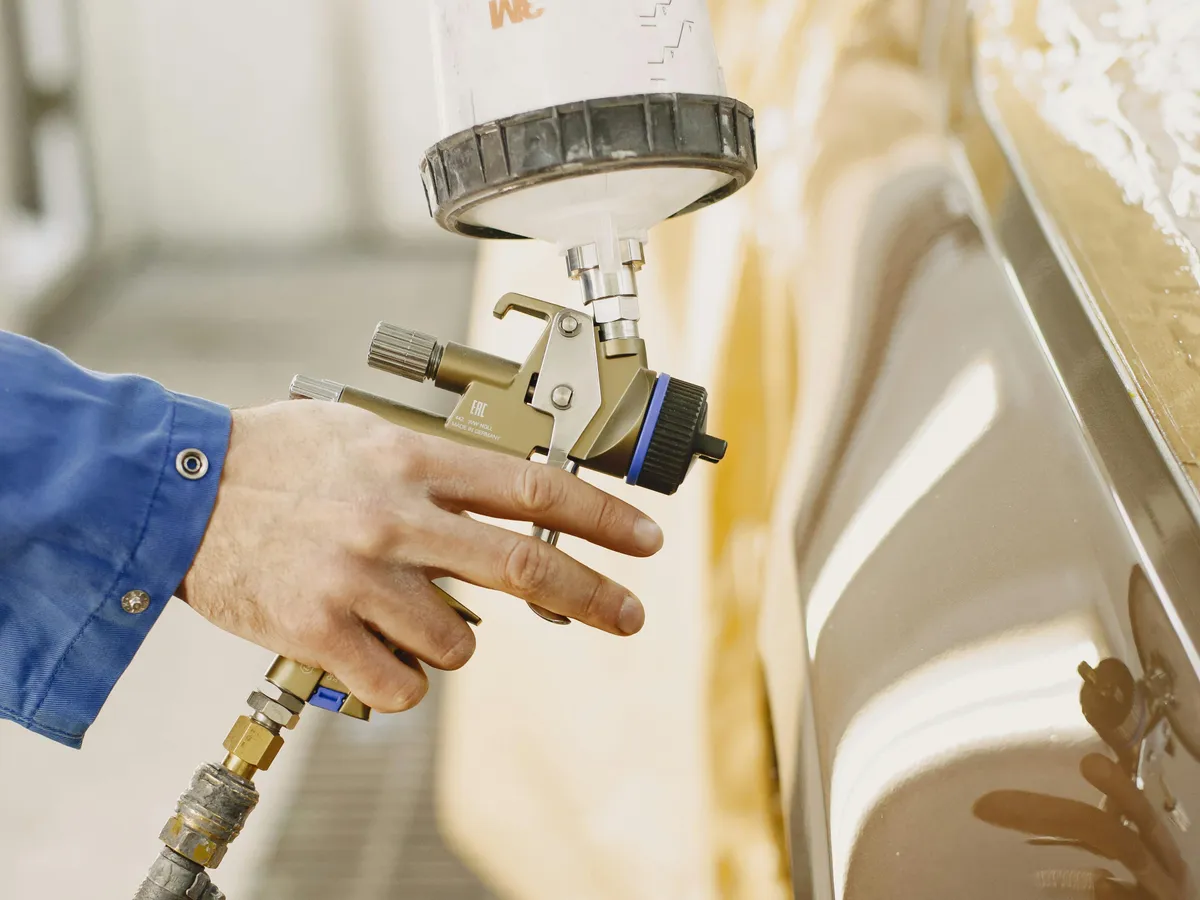 Spray application of a protective coating during phenalkamine hardener evaluation