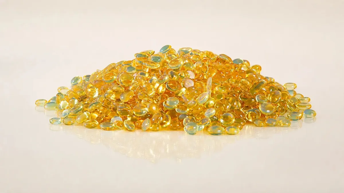 Amber resin pellets for printing ink and adhesive formulations
