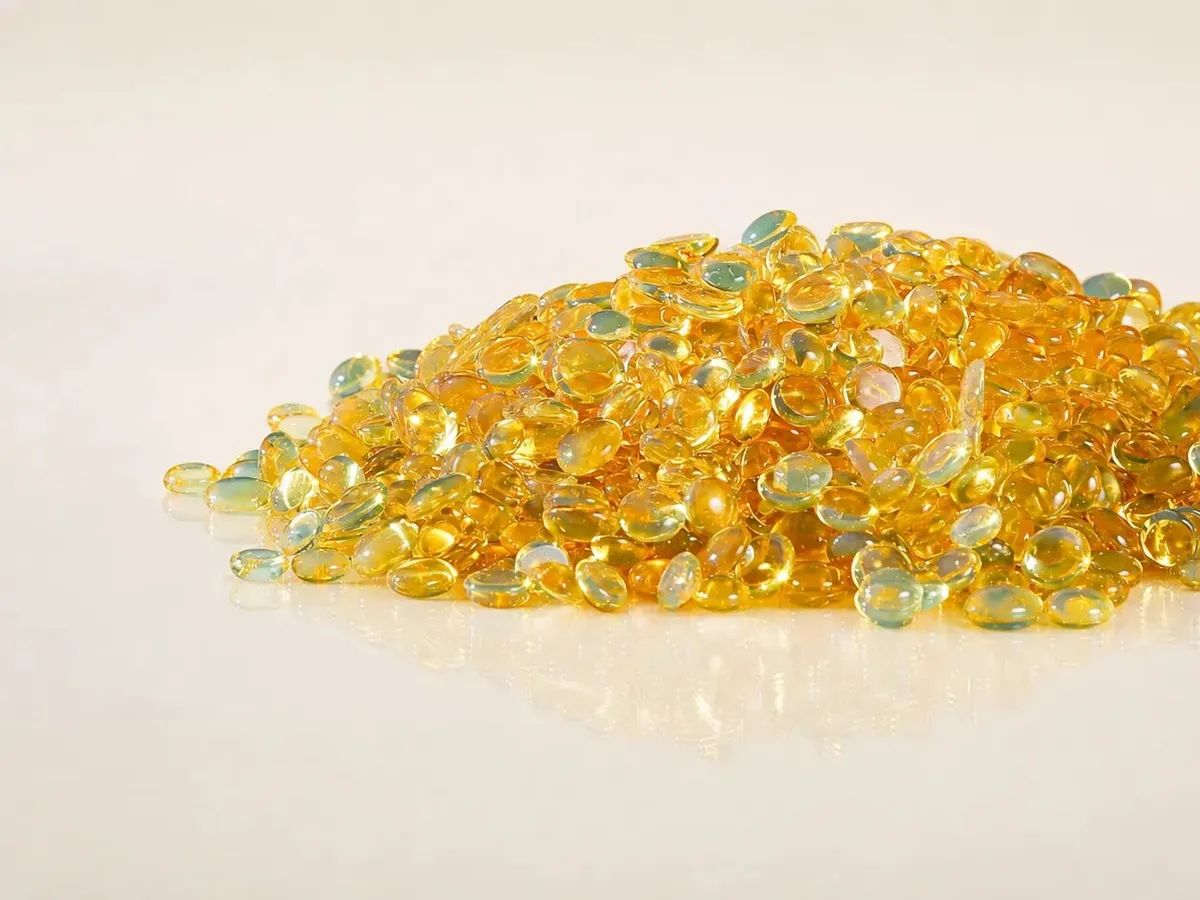 Amber resin pellets for printing ink and adhesive formulations